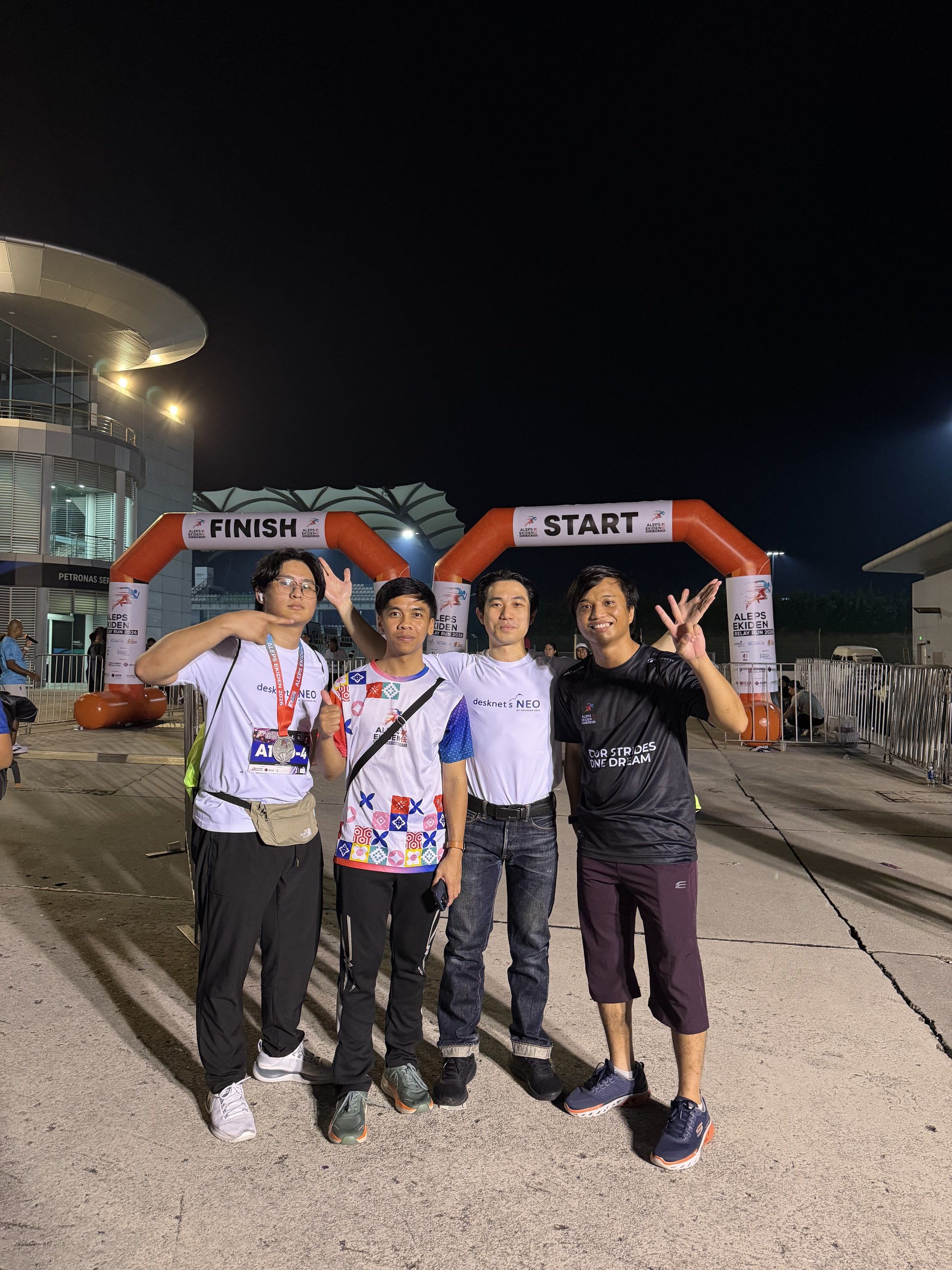 NEOREKA ASIA team at the ALEPS Ekiden Relay Run 2026 start and finish arches
