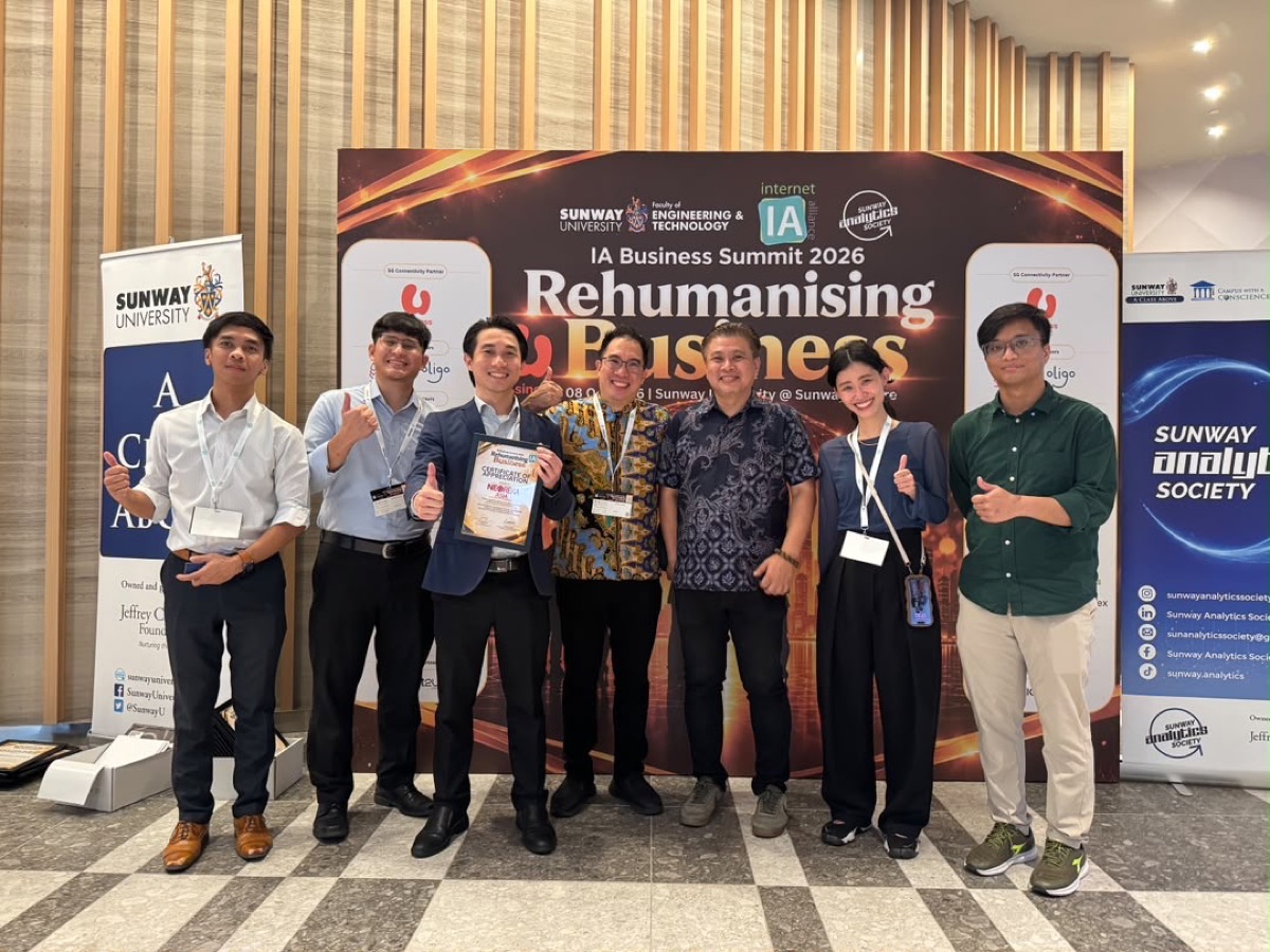 NEOREKA ASIA team with the summit organisers, holding a Certificate of Appreciation in front of the IA Business Summit 2026 Rehumanising Business backdrop